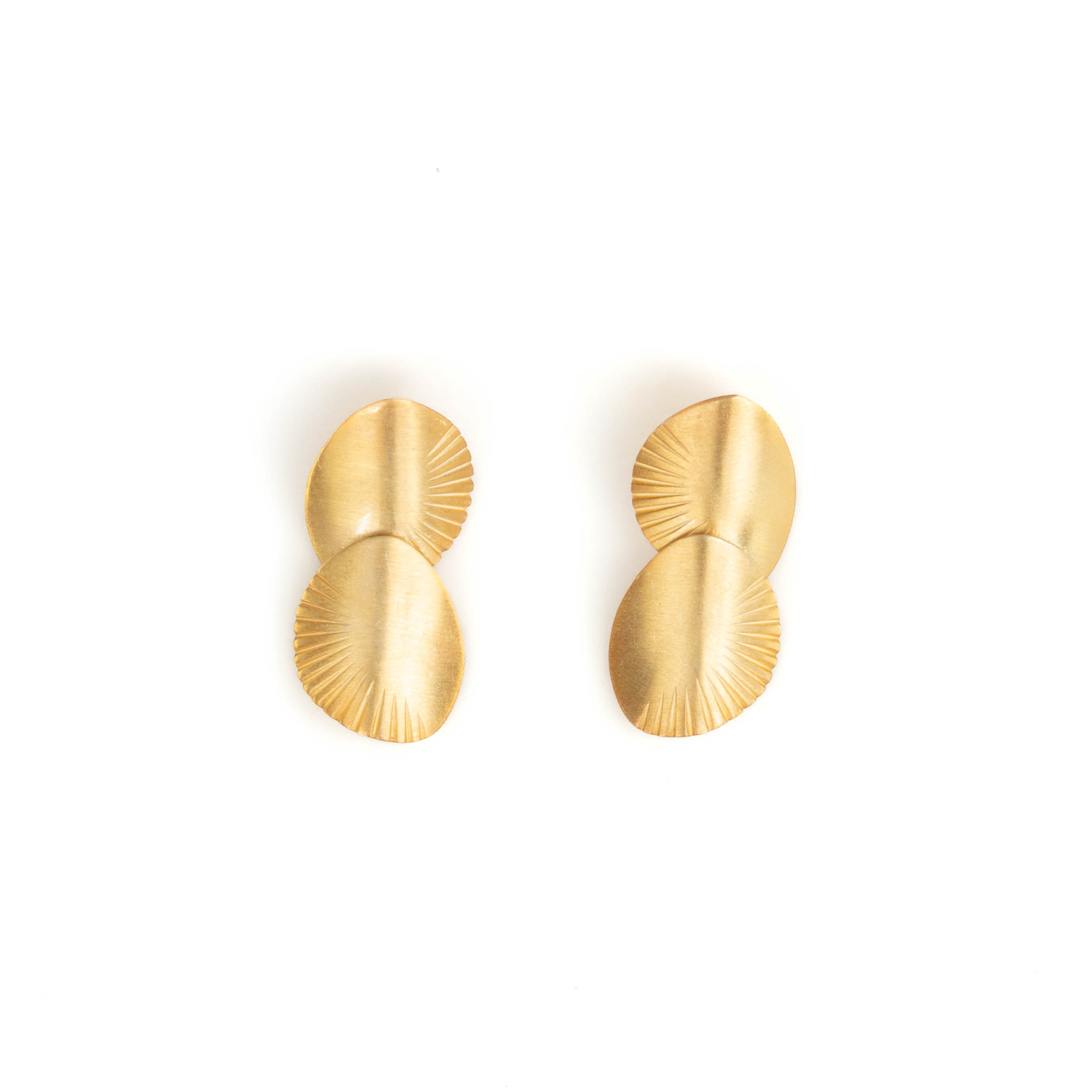Pair of gold earrings on a white background