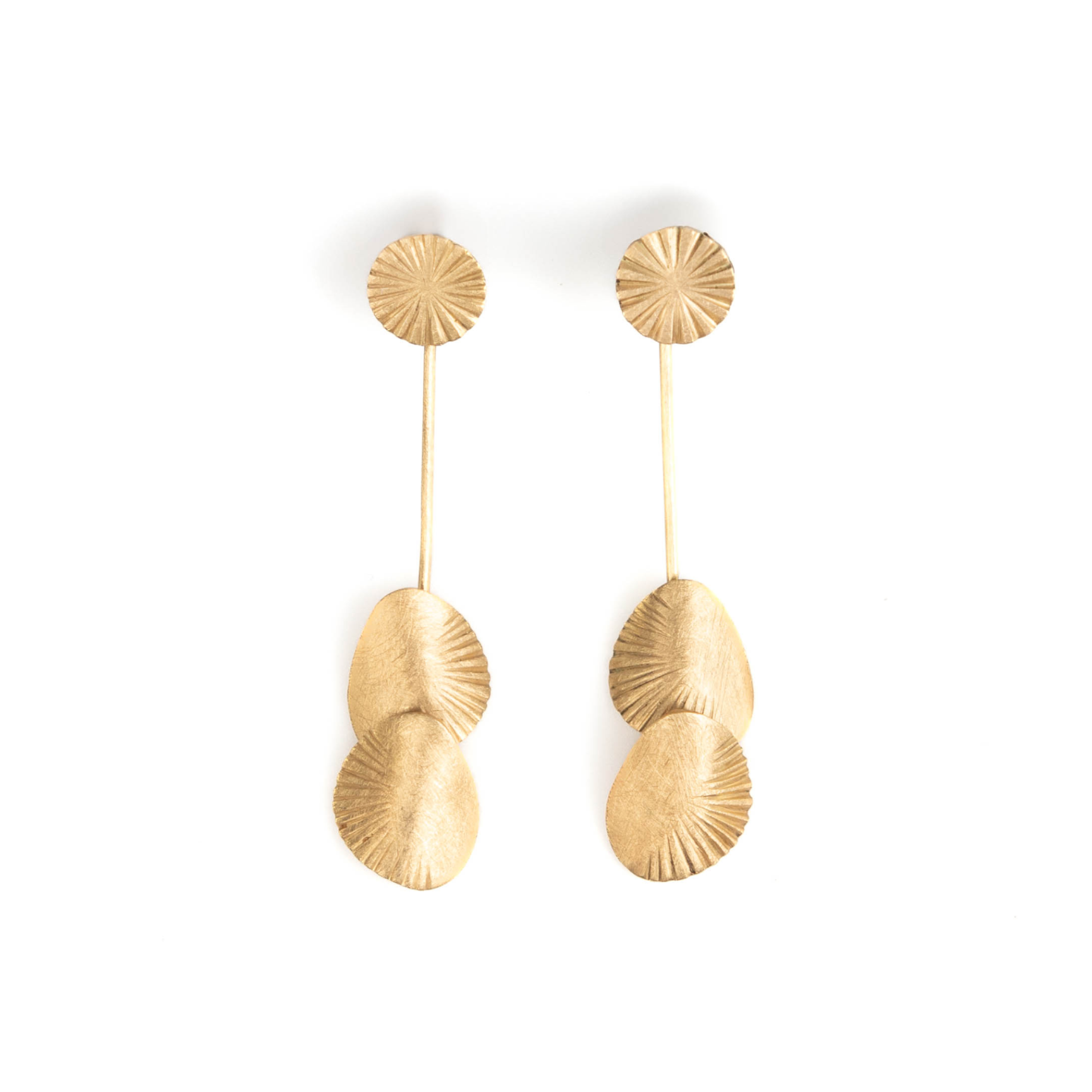 Pair of gold earrings on a white background
