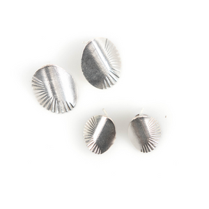 Set of silver earrings on a white background