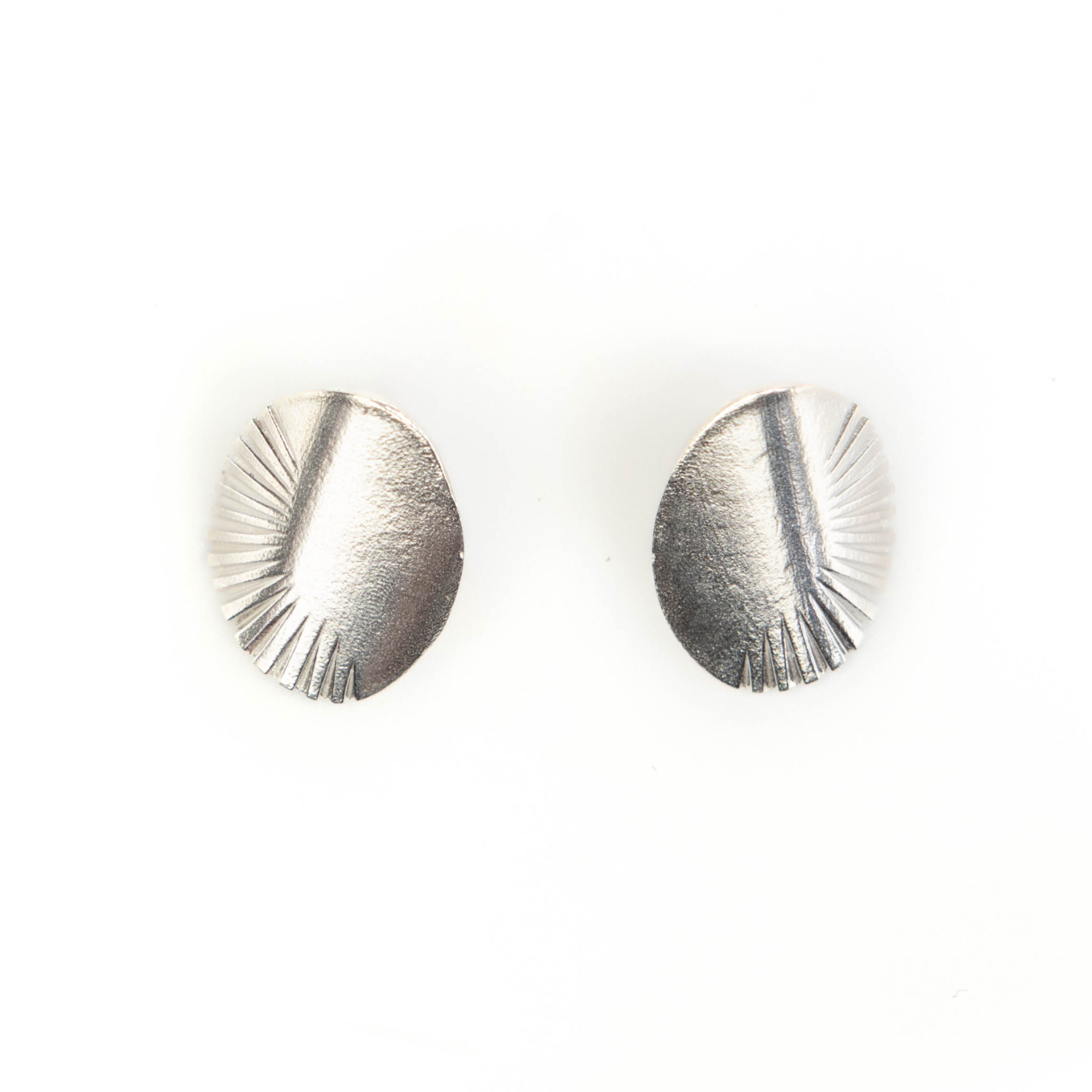 Pair of silver earrings on a white background